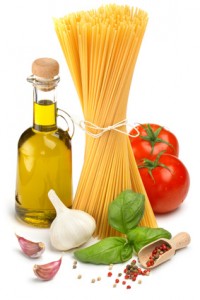 spaghetti, bottle of olive oil, tomatoes and herbs